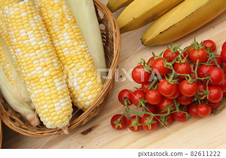 Tomatoes and Corn on Table For Sale in Organic Market 82611222