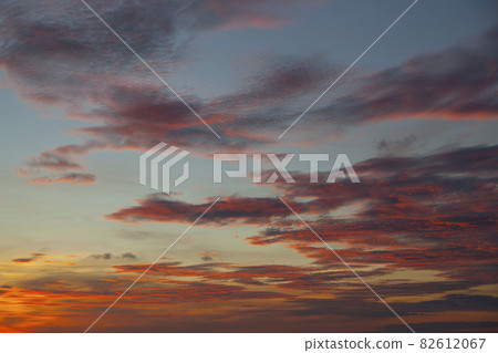 Pink sunset sky background. Picturesque colorful red clouds in the sky. Vast sky landscape, sunset sky view. 82612067