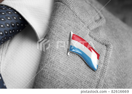 Metal badge with the flag of Luxembourg on a suit lapel Metal badge with the flag of Luxembourg on a suit lapel 82616669