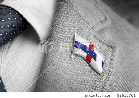 Metal badge with the flag of Netherlands Antilles on a suit lapel 82616701