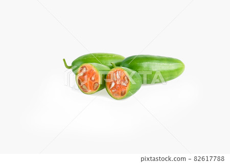 Coccinia grandis raw green on a white background. Coccinia grandis raw green on a white background. 82617788