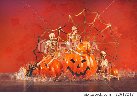 Halloween skeletons having Spooky party with pumpkin and spider Halloween skeletons having Spooky party with pumpkin and spider 82618218