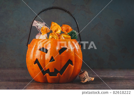 Orange halloween pumpkins with golden spider webs Orange halloween pumpkins with golden spider webs 82618222