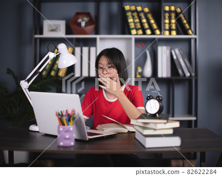 School girl watching online accidentally watching inappropriate content while surfing the internet. School girl watching online accidentally watching inappropriate content while surfing the internet. 82622284
