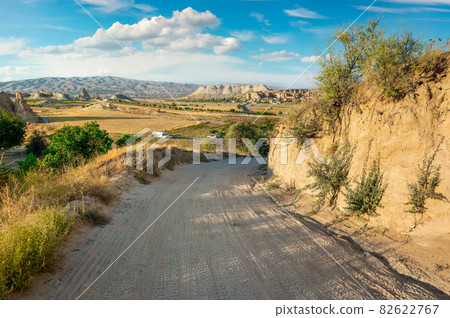 Country road in valley 82622767