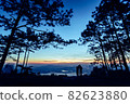 Silhouette couple with a beautifu mountain ridge and sky 82623880