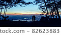 Silhouette couple with a beautifu mountain ridge and sky 82623883