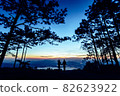 Silhouette couple with a beautifu mountain ridge and sky 82623922