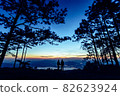 Silhouette couple with a beautifu mountain ridge and sky 82623924