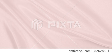 Smooth elegant pink silk or satin texture as wedding background. Luxurious background design Smooth elegant pink silk or satin texture as wedding background. Luxurious background design 82628691