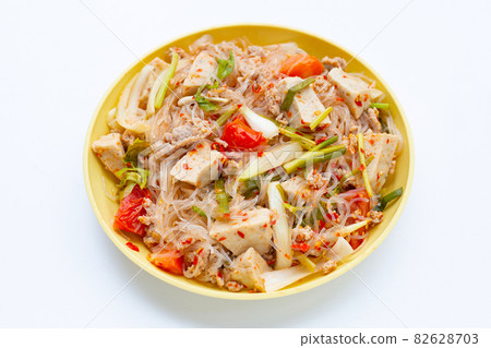 Dish of spicy vermicelli salad on white background. Dish of spicy vermicelli salad on white background. 82628703