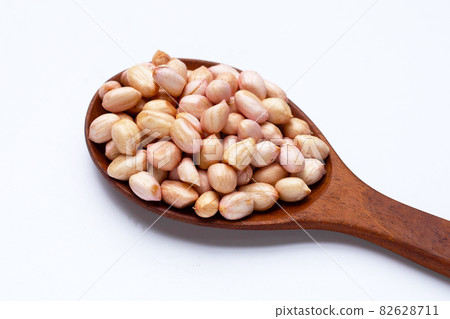 Raw peanuts on white background. Raw peanuts on white background. 82628711