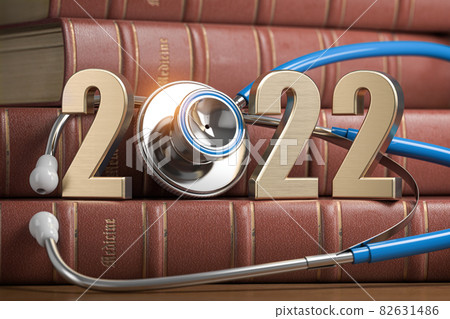 2022 Happy New Year for health care medicine and pharmacy industry. Number 2022 with stethoscope on vintage books of medicine. 82631486