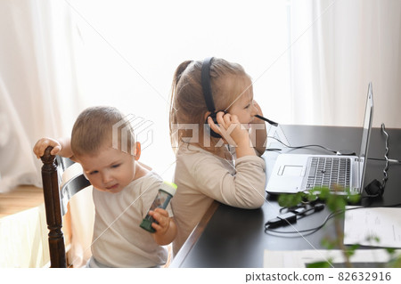 Little children play with computer of parents Little children play with computer of parents 82632916