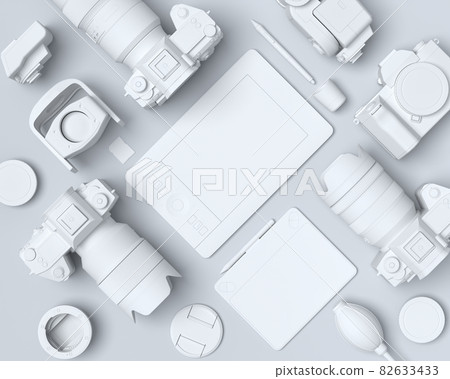 Top view of monochrome designer workspace and photography gear on black table 82633433