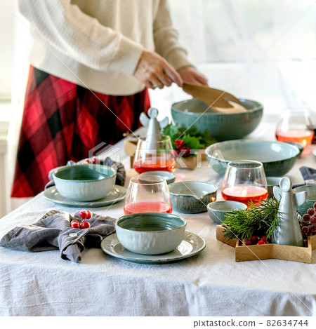 Christmas table setting with craft ceramic tableware 82634744