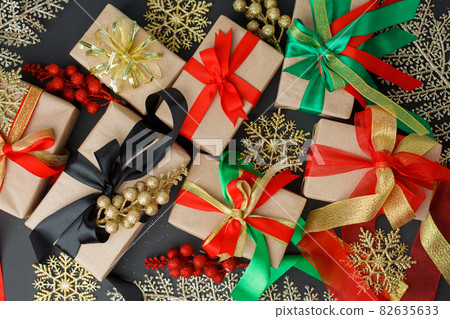 Luxury stylish Merry Christmas and Happy Holidays greeting card, banner. New Year. Noel. Christmas silver ornaments and gift on black, top view. Winter xmas holiday Luxury stylish Merry Christmas and Happy Holidays greeting card, banner. New Year. Noel. Christmas silver ornaments and gift on black, top view. Winter xmas holiday 82635633
