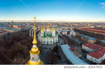 Aerial top view to St. Nicholas Naval Sea Cathedral in sunny day. Panorama of evening historical city center. Orthodox church located on banks of Kryukov and Griboyedov canal. Saint Petersburg. Russia Aerial top view to St. Nicholas Naval Sea Cathedral in sunny day. Panorama of evening historical city center. Orthodox church located on banks of Kryukov and Griboyedov canal. Saint Petersburg. Russia 82637055