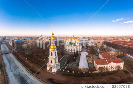 Aerial top view to St. Nicholas Naval Sea Cathedral in sunny day. Panorama of evening historical city center. Orthodox church located on banks of Kryukov and Griboyedov canal. Saint Petersburg. Russia Aerial top view to St. Nicholas Naval Sea Cathedral in sunny day. Panorama of evening historical city center. Orthodox church located on banks of Kryukov and Griboyedov canal. Saint Petersburg. Russia 82637058