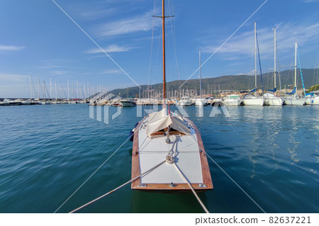 Wood sloop sail boat in harbor Wood sloop sail boat in harbor 82637221