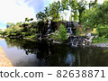 Sports tourism center in park of Far Eastern Federal University FEFU, located on Russky Island. Park with lake, waterfalls and forest near embankment. Tourists are engaged in outdoor activities 82638871