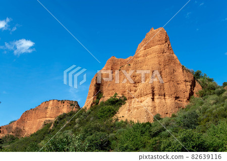 Bright orange wrecking mountains at the Las Medulas World Heritage Site. 82639116