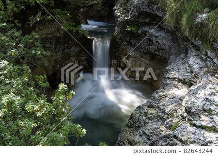 waterfalls of a river in the wood 82643244