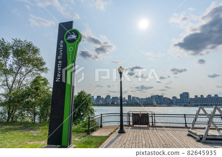 Montreal, Quebec, Canada - August 3 2021 : Jean-Drapeau park maritime shuttle landing stage. Saint Helens Island in sunset time. Montreal, Quebec, Canada - August 3 2021 : Jean-Drapeau park maritime shuttle landing stage. Saint Helens Island in sunset time. 82645935