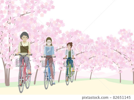 Women riding a bicycle under a row of cherry blossom trees Women riding a bicycle under a row of cherry blossom trees 82651145