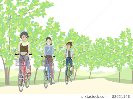 Women riding a bicycle in the fresh green 82651148