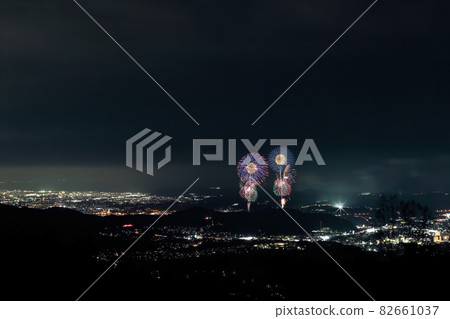 Fireworks and night view (wide-angle) launched from the summit of Mt. Kobo 82661037
