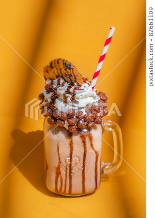 Mason jar milkshake with chocolate, cake. Mason jar milkshake with chocolate, cake. 82661109