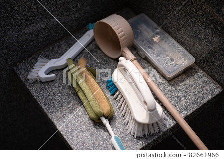 A set of cleaning tools used when visiting graves during Obon and Higan, including a ladle and brush placed on the gravestone A set of cleaning tools used when visiting graves during Obon and Higan, including a ladle and brush placed on the gravestone 82661966