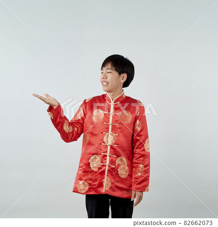 Asian man with Chinese traditional dress cheongsam Asian man with Chinese traditional dress cheongsam 82662073