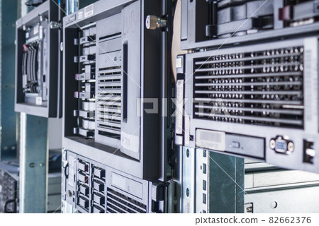 Cluster of data storage hard drives inside server room 82662376