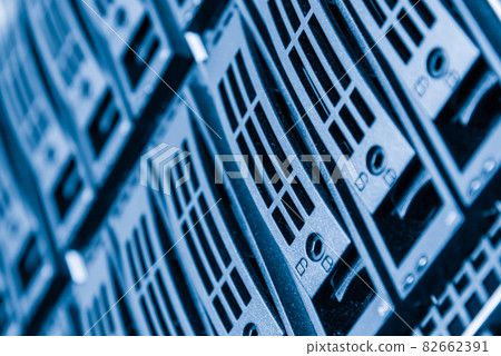 Cluster of data storage hard drives inside server room 82662391