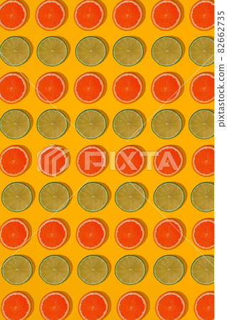 Grapefruit and lime pattern on yellow background. Minimal flat lay concept. Grapefruit and lime pattern on yellow background. Minimal flat lay concept. 82662735