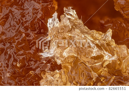 Crystalized honey African lychee , white crystals forming regular shapes. Microscope photo, image width 9mm Crystalized honey African lychee , white crystals forming regular shapes. Microscope photo, image width 9mm 82665551