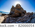 Towering rock on the beach 82666054