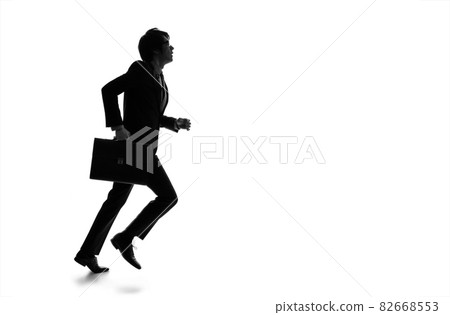 Running businessman silhouette 82668553