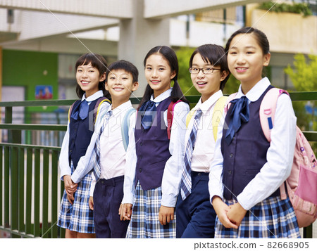 portrait of a group of asian elementary school children looking at camera smiling portrait of a group of asian elementary school children looking at camera smiling 82668905