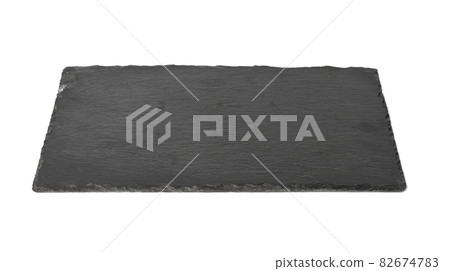 big rectangular black slate stone board isolated on white background, utensils for serving food 82674783