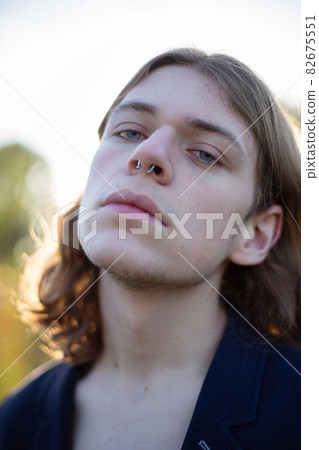 Man with long hair portrait 82675551