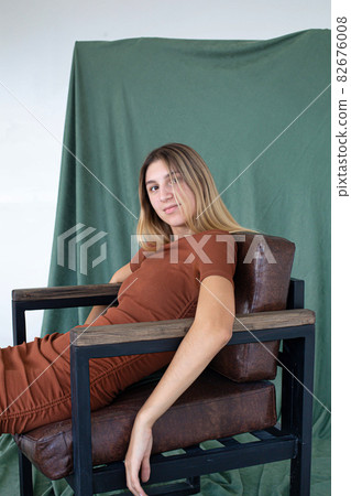Girl with blonde hair partially green background 82676008