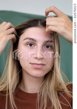 Girl with blonde hair partially green background Girl with blonde hair partially green background 82676023