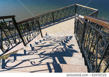 Granite staircase to the observation deck over the river. Granite staircase to the observation deck over the river. 82676520