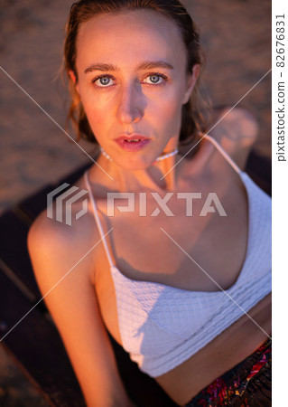Girl with blonde hair with sand on background Girl with blonde hair with sand on background 82676831