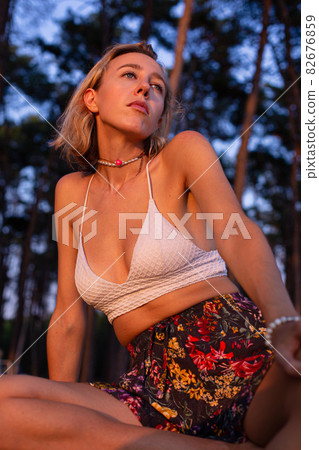 Girl with blonde hair in the forest Girl with blonde hair in the forest 82676859