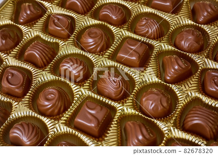 Open box of chocolate treets Open box of chocolate treets 82678320