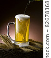 poured fresh frothy beer mug 82678368